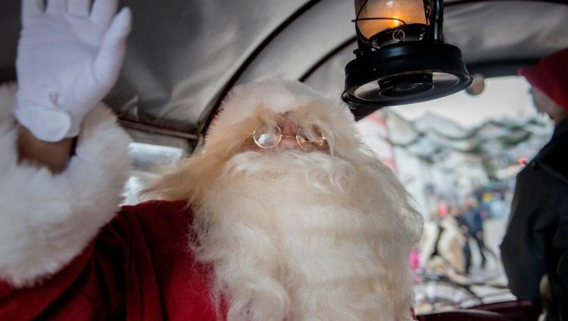 Santa Claus in a horse-drawn carriage on the pedestrian street