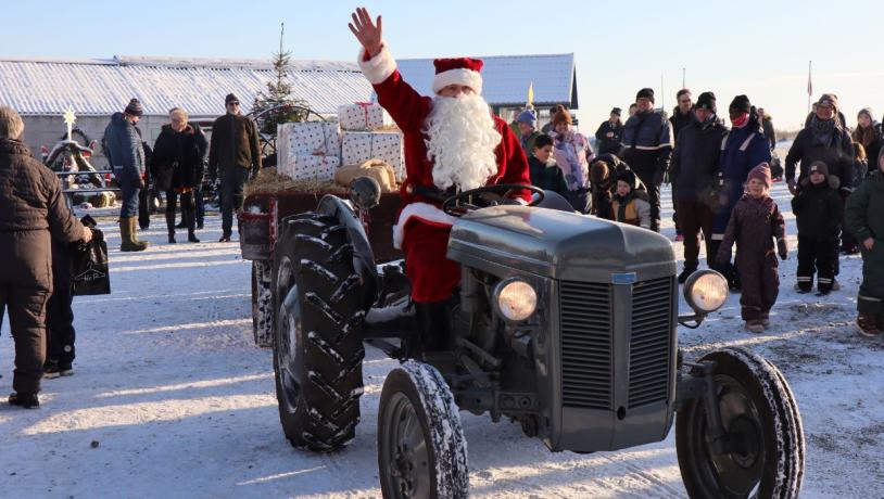 Father Christmas arrives on a tractor at the Christmas market at Tinnetgaard