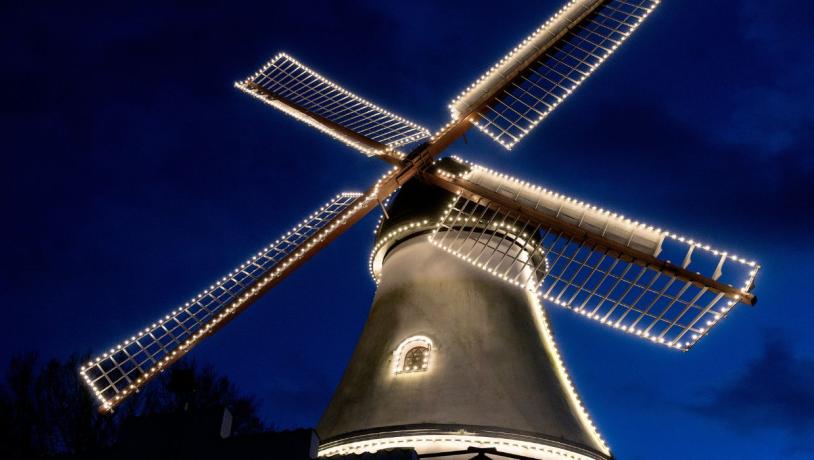 The Christmas lights shine at Vejle Windmill in December