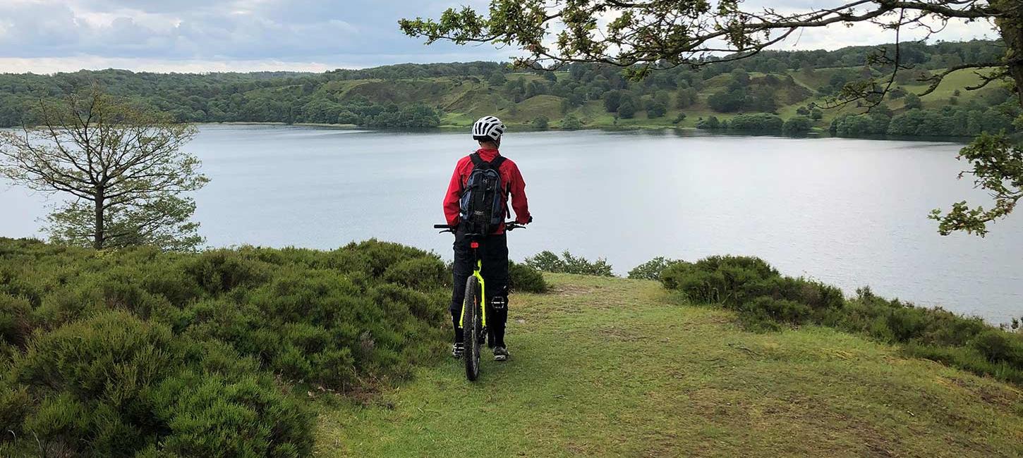 Mountain biker with a view of a lake