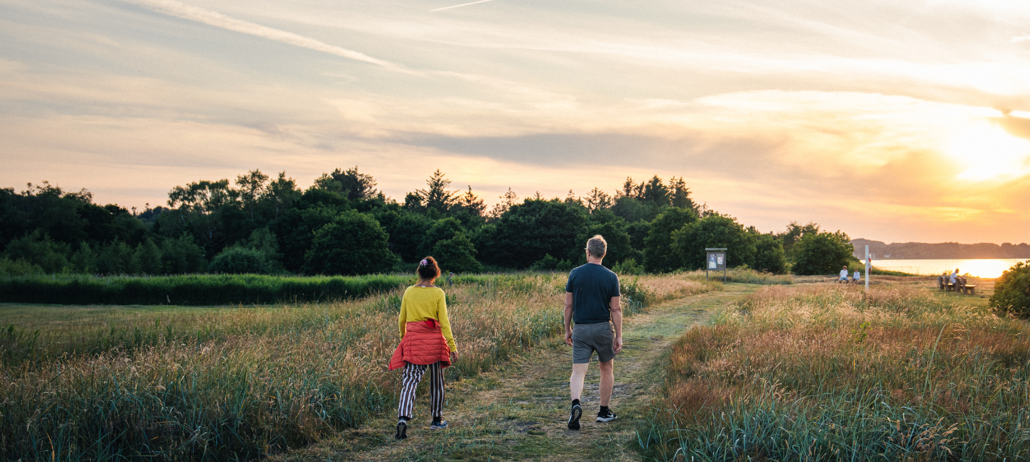 Couple walking in the evening at Mørkholt Strand