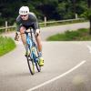 Road cyclist cycle down the Munkebjerg hill