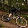 Cyclist on the way down the mountain bike hill in Nørreskoven Forest