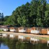 Cabins at Randbøldal Camping by the lake on a summer day