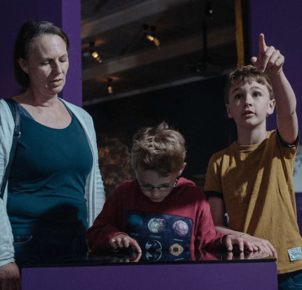 Mother and sons at exhibition at Kongernes Jelling